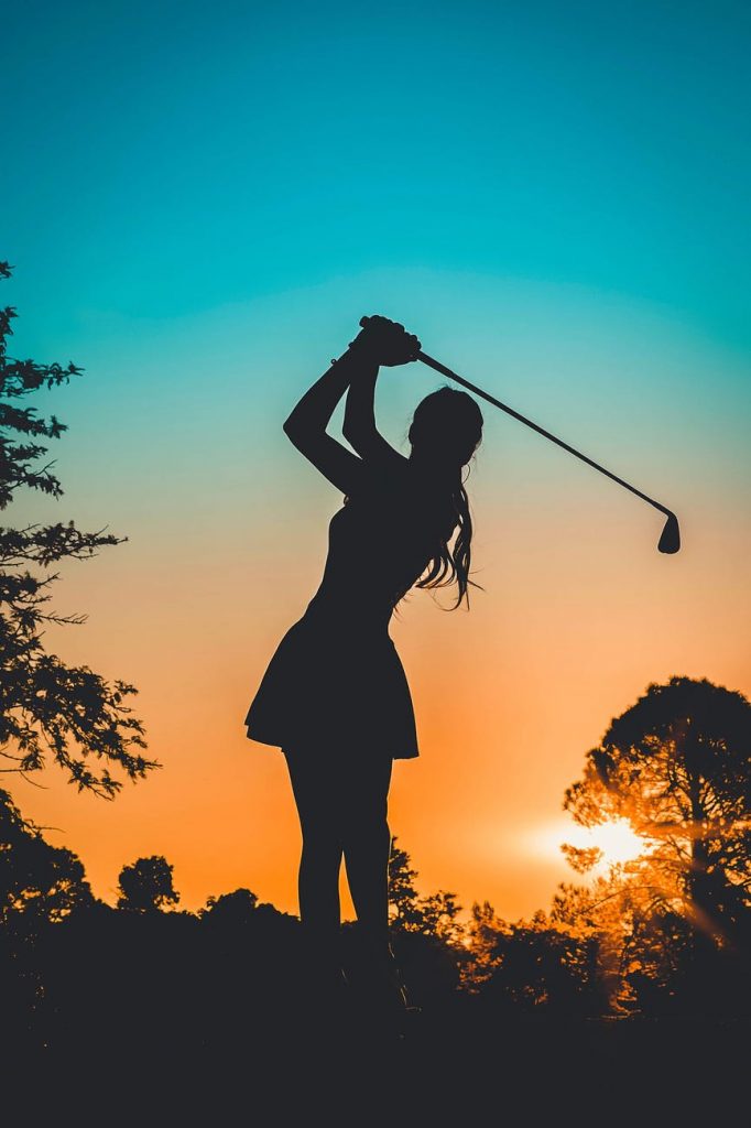 girl playing golf